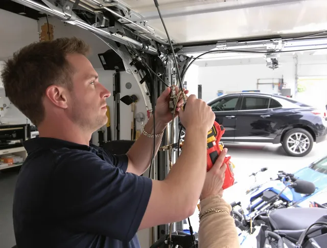 Killingly Garage Door Repair safety certified technician performing cable replacement in Killingly