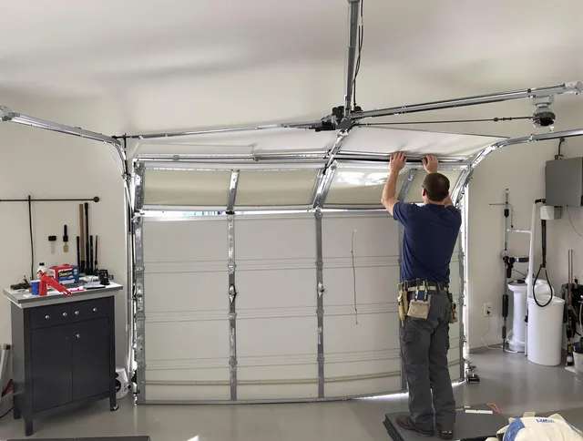 Killingly Garage Door Repair specialist performing precise section replacement on Killingly garage door